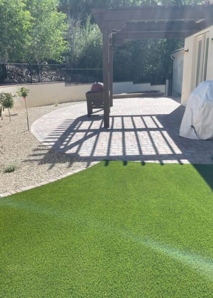 Landscaper building a decorative block wall for a residential property in Chino Valley, AZ