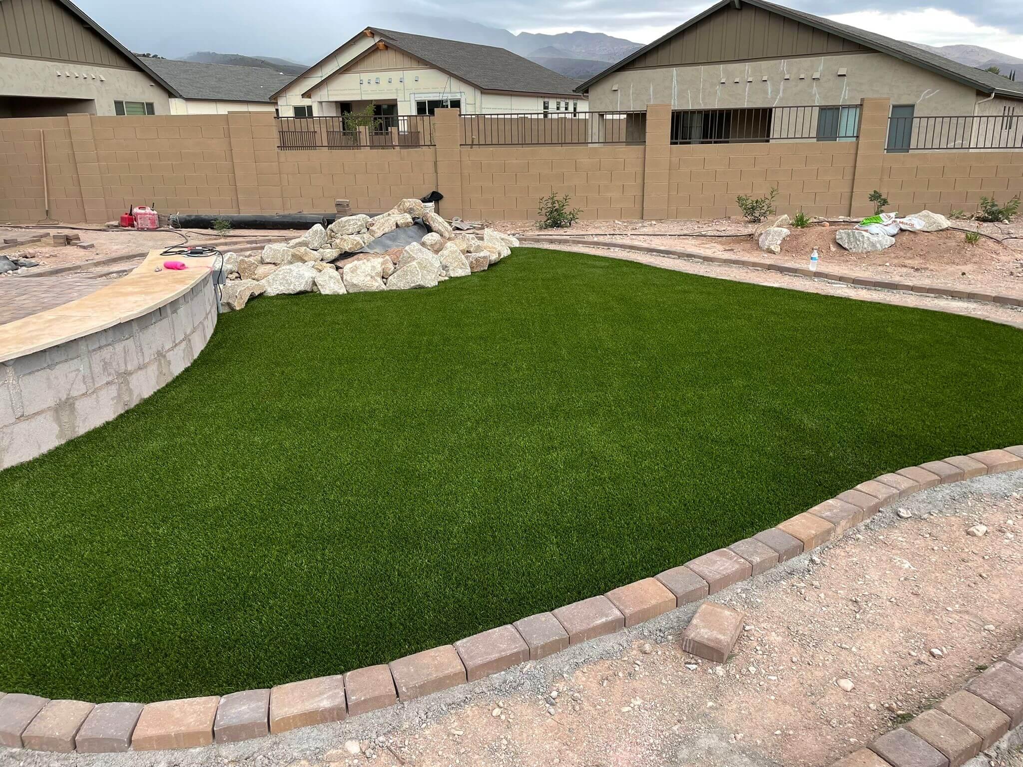 Fearno Landscaping LLC (35) Freshly laid real grass turf with clean edges and irrigation system in place